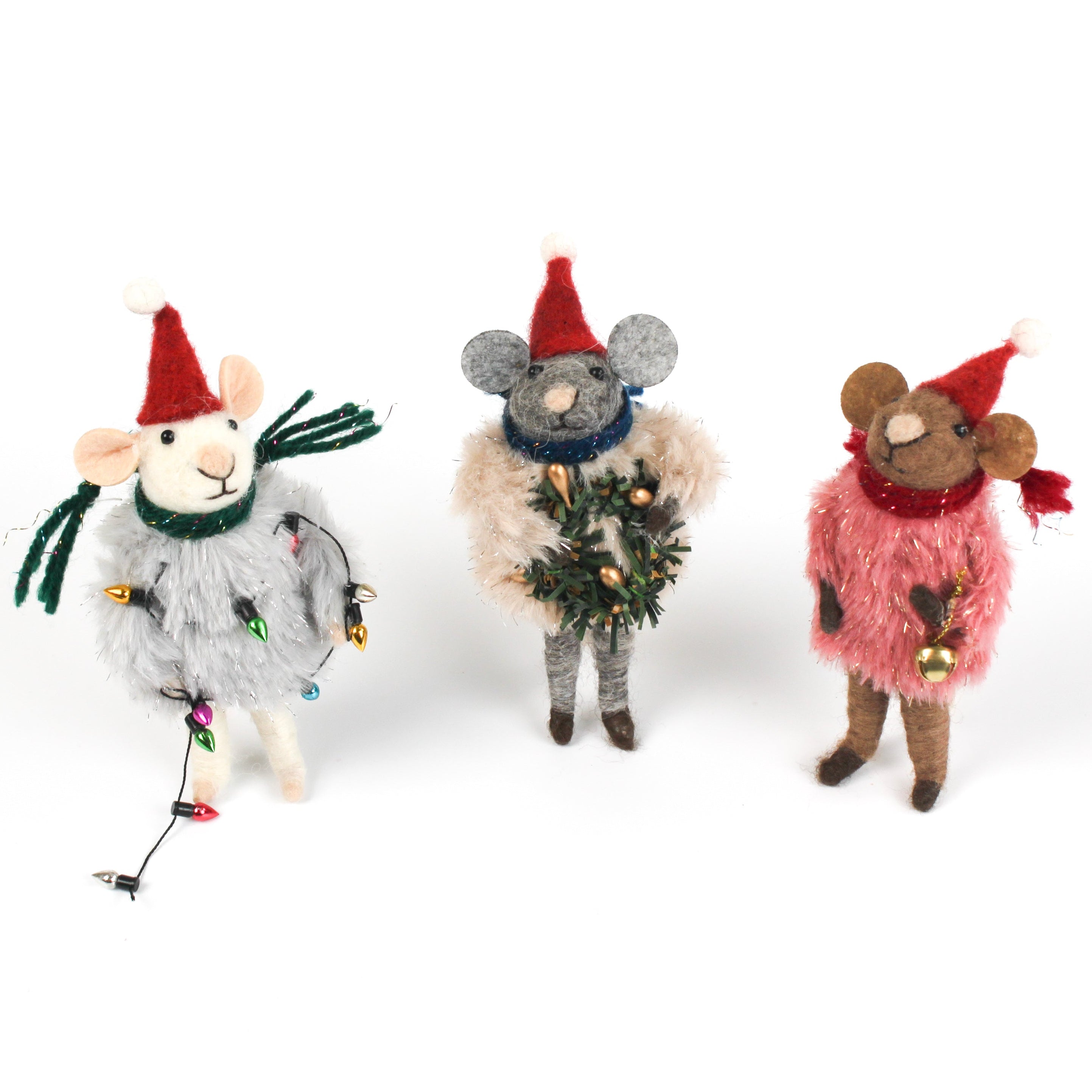 Three festive felt mouse ornaments dressed in fuzzy holiday outfits and Santa hats, holding Christmas decorations like string lights, a wreath, and a gold bell.