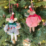 two festive felt mouse ornaments dressed in fuzzy holiday outfits and Santa hats, holding Christmas decorations like string lights, and a gold bell.