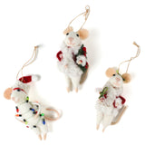 Three white felt mouse ornaments dressed in cozy winter outfits, one wrapped in colorful holiday lights, one holding a Christmas wreath, and one holding a festive ornament