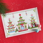 Festive Pagodas Rectangular Paper Christmas Placemats on a red surface