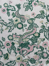 Flat view of Madcap Cottage's East of the Sun chinoiserie print cloth dinner napkin showing detail of dragon and florals in pattern.