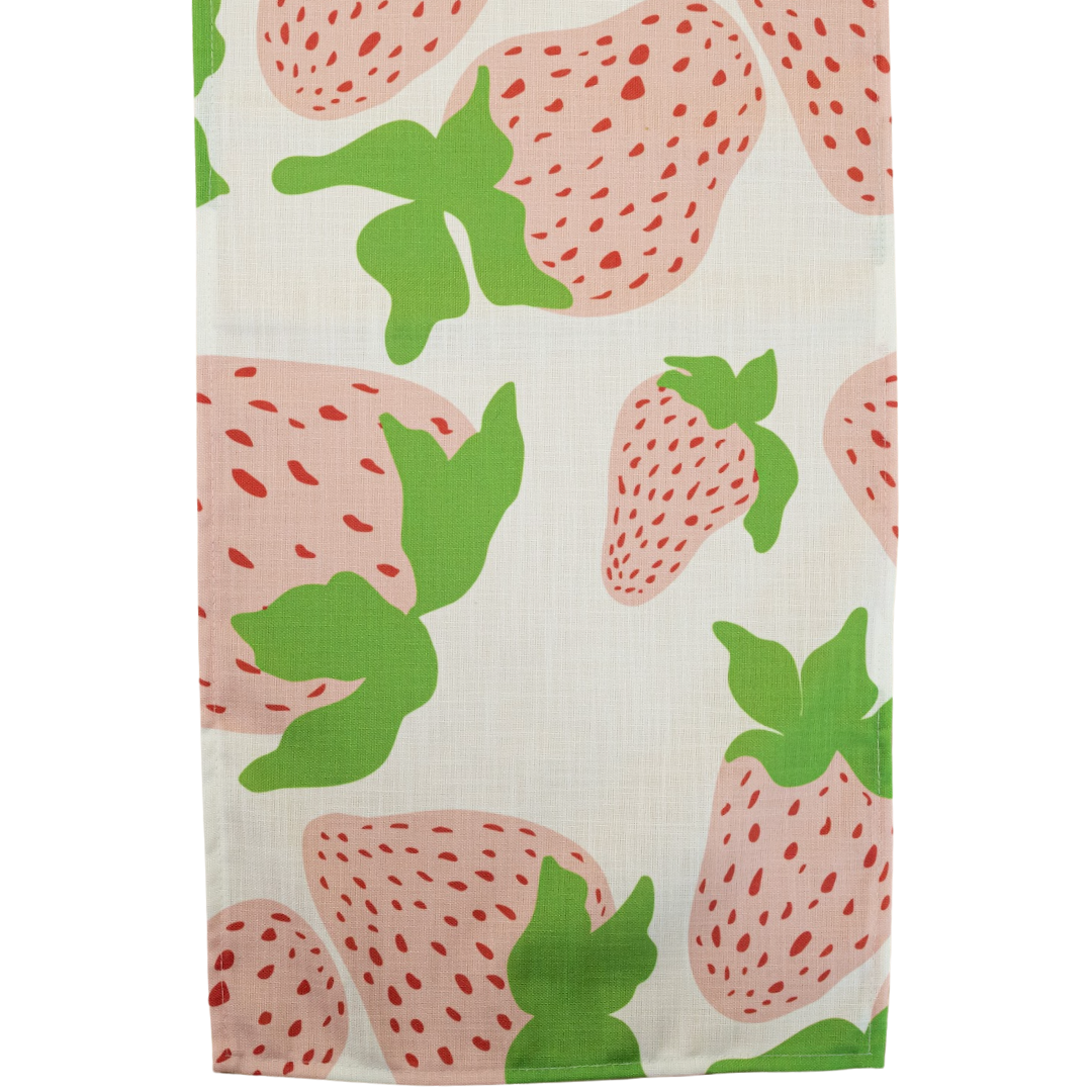 Garden Party Strawberry cloth table runner designed by madcap cottage with motifs of large pink and green strawberries with green stems.