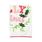A Madcap Cottage Christmas tea towel with holly motifs and text that reads Have a Holly Jolly Christmas