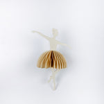 Decorative ballerina christmas ornament with beige skirt on a white background