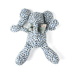 Blue and white patterned stuffed elephant toy with a green bow.
