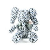 Blue and white patterned stuffed elephant toy with a green bow.