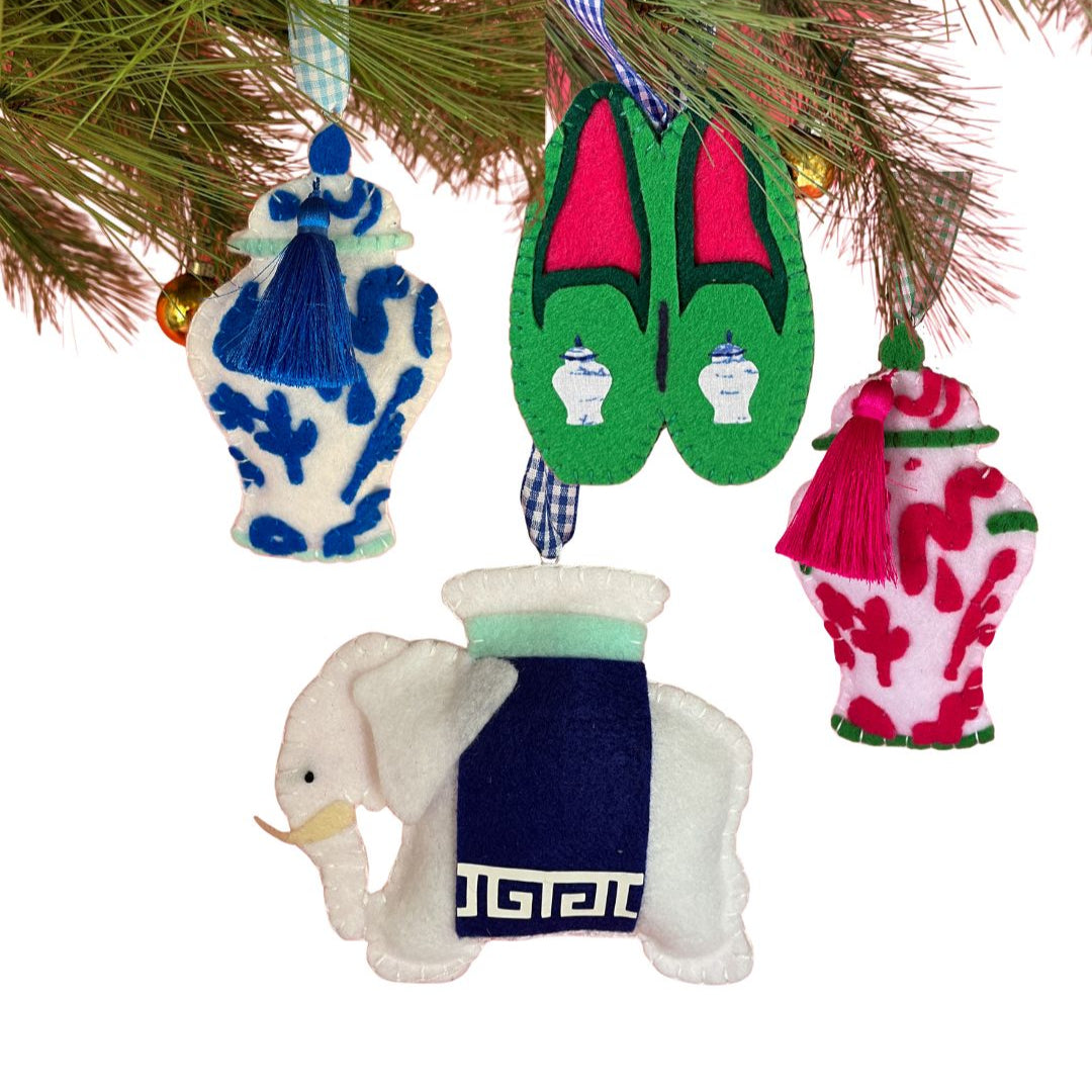 felt chinoiserie Christmas ornaments including a blue ginger jar, red ginger jar green loafers, and elephant on a white background.