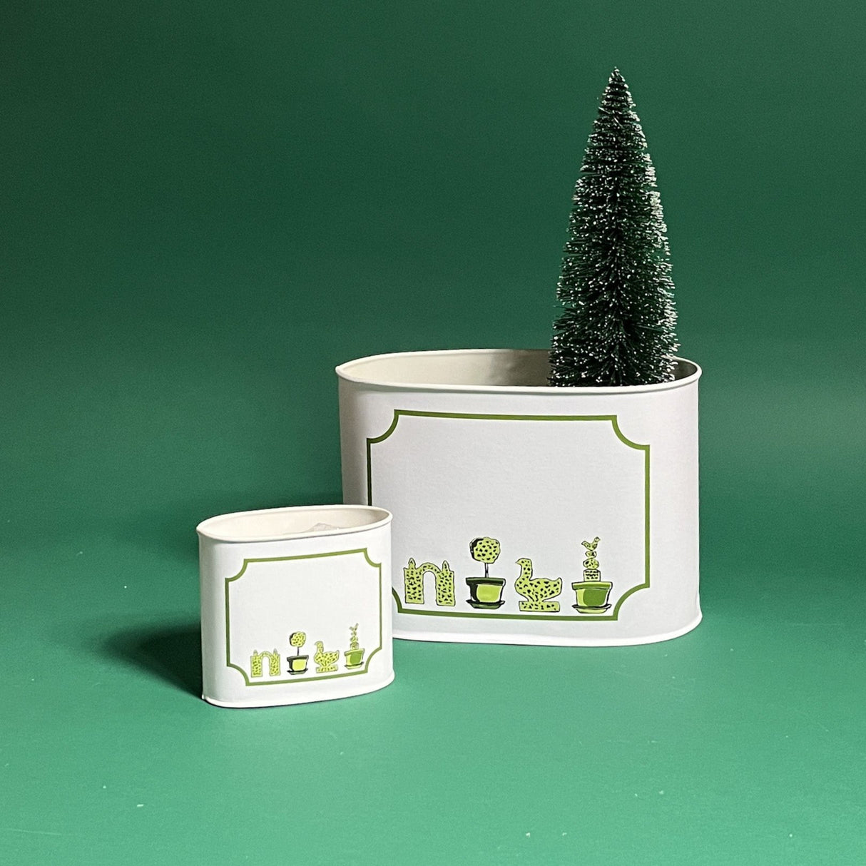 Garden Follies, filled duo of caddies in large and small on a green background