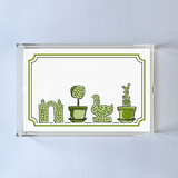 Garden Follies is a rectangular acrylic tray with a white base and green topiary motifs on the bottom border. 