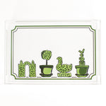 Garden Follies is a rectangular acrylic tray with a white base and green topiary motifs on the bottom border. 