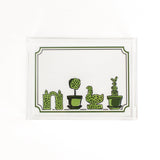 Garden Follies is a rectangular acrylic tray with a white base and green topiary motifs on the bottom border. 