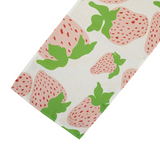 Garden Party Strawberry cloth table runner designed by madcap cottage with motifs of large pink and green strawberries with green stems.