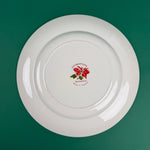 Back view of Cuthbertson Poinsettia Christmas plate showing maker’s mark and red floral stamp.