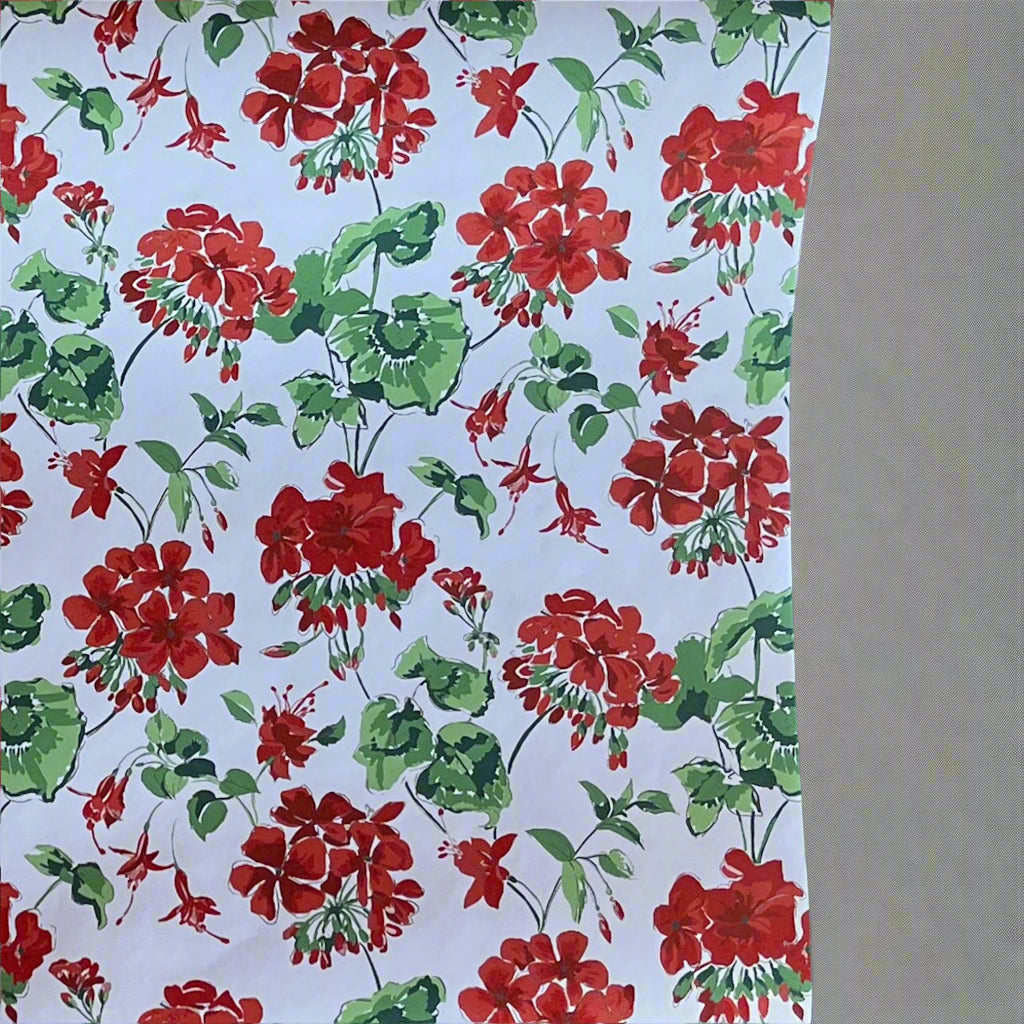 Wrapping paper unrolled to see the full red geranium pattern