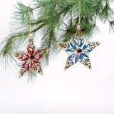 Two gilt metal star shaped Christmas ornaments decorated with colorful crystal accents