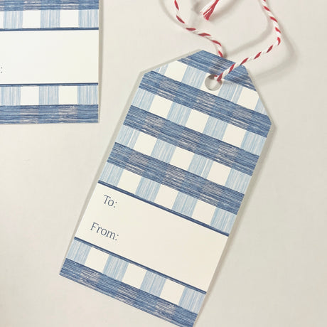 A blue gingham patterned gift tag with a white space for personalization on the back, displayed on a white background.