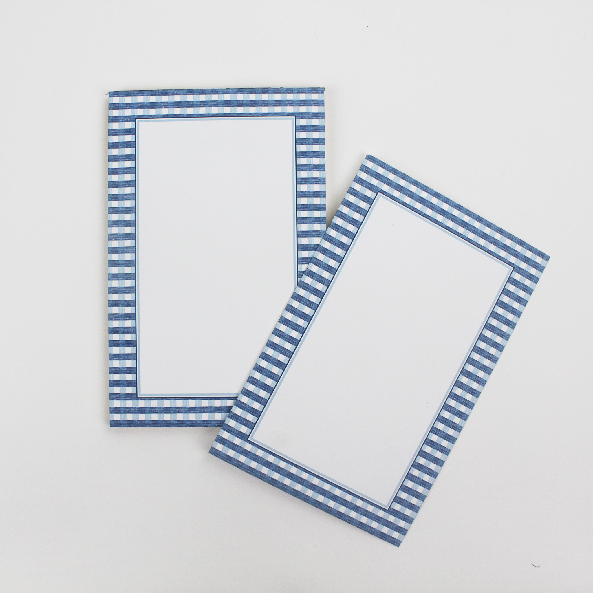 a luxury notepad with a blue gingham border