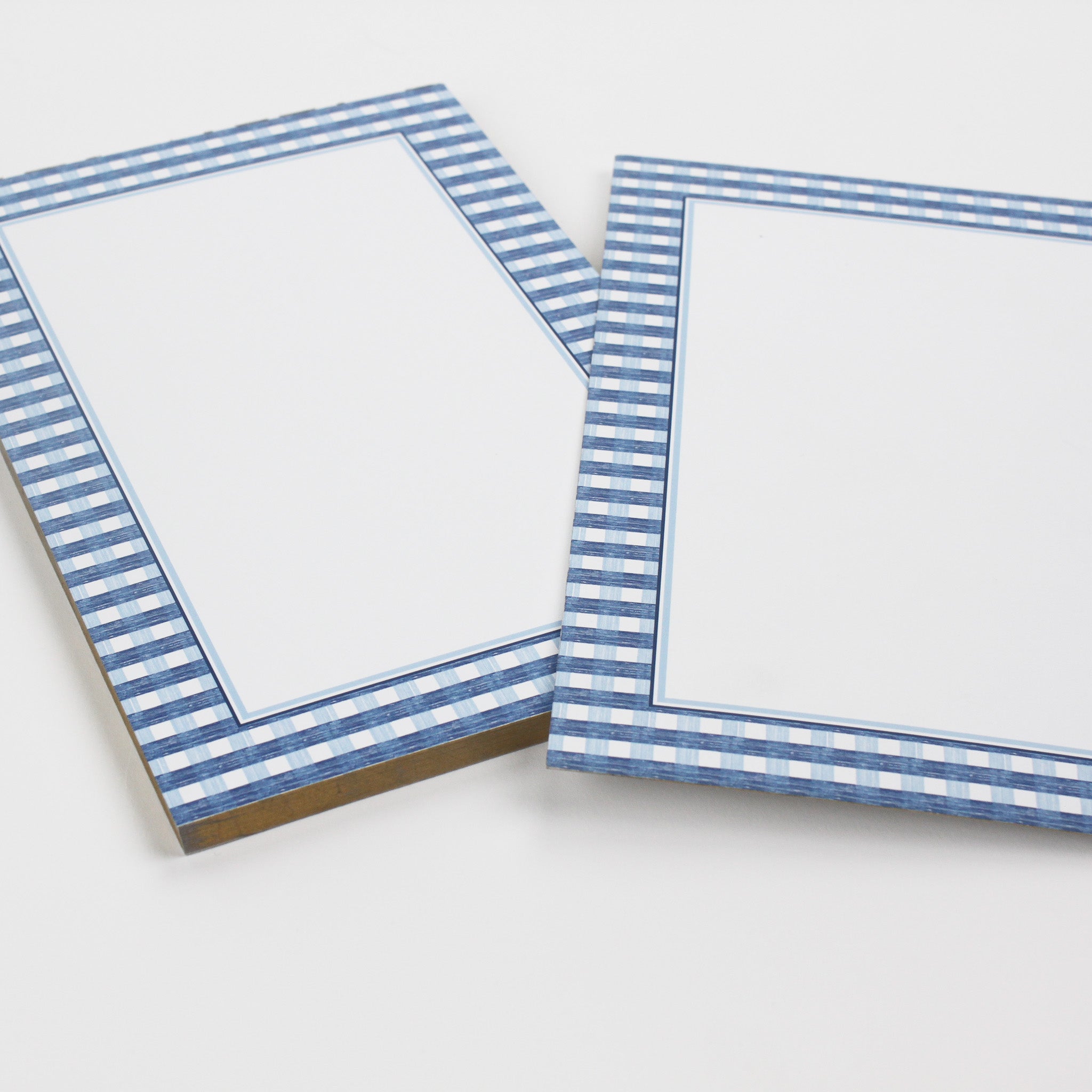 a luxury notepad with a blue gingham border