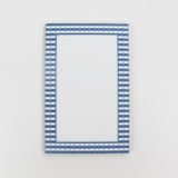 a luxury notepad with a blue gingham border