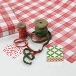 A roll of red gingham wrapping paper 