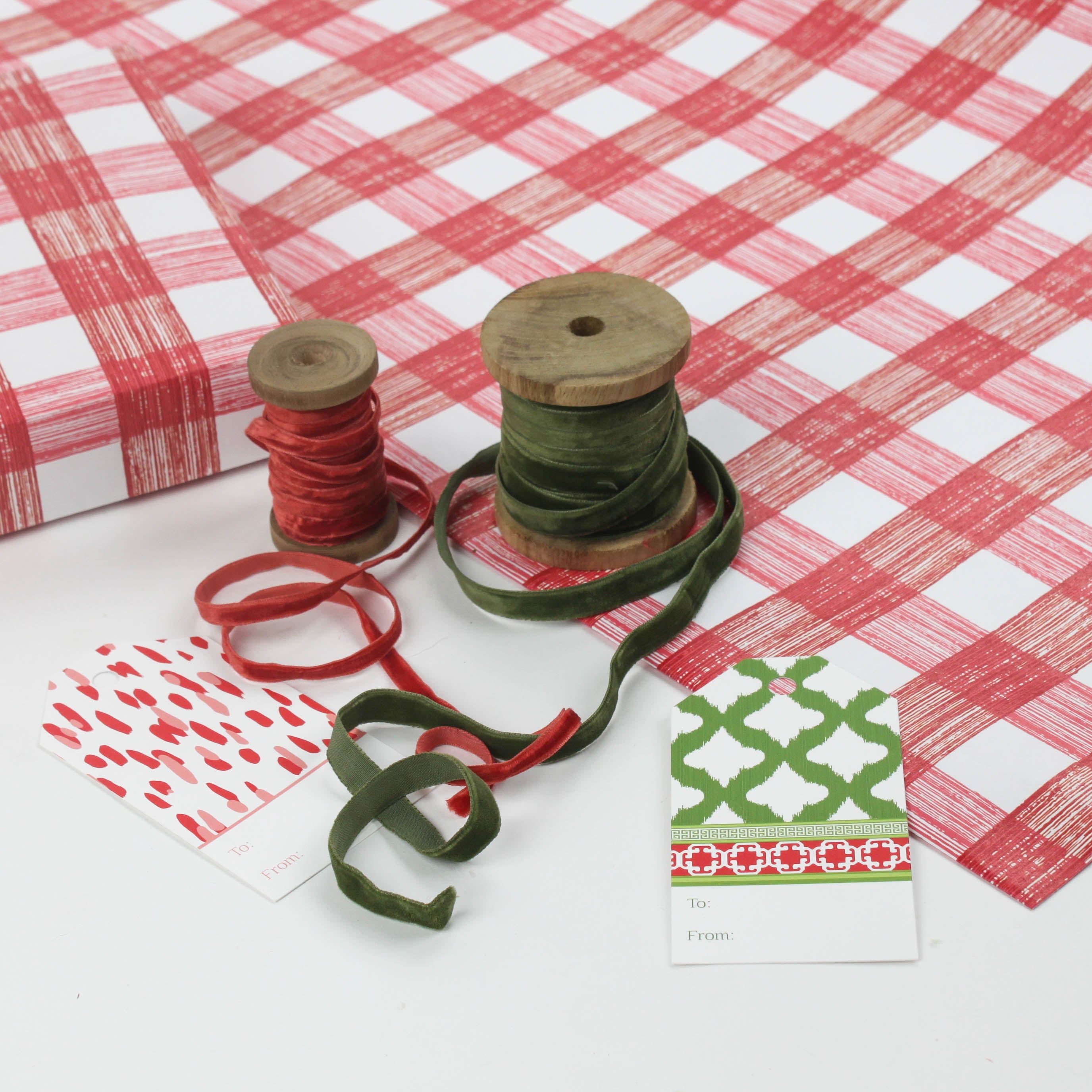 A roll of red gingham wrapping paper 
