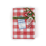 A roll of red gingham wrapping paper 