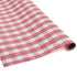 A roll of pink gingham wrapping paper 