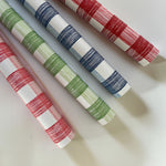 four gingham paper table runners in pink, green, blue and red