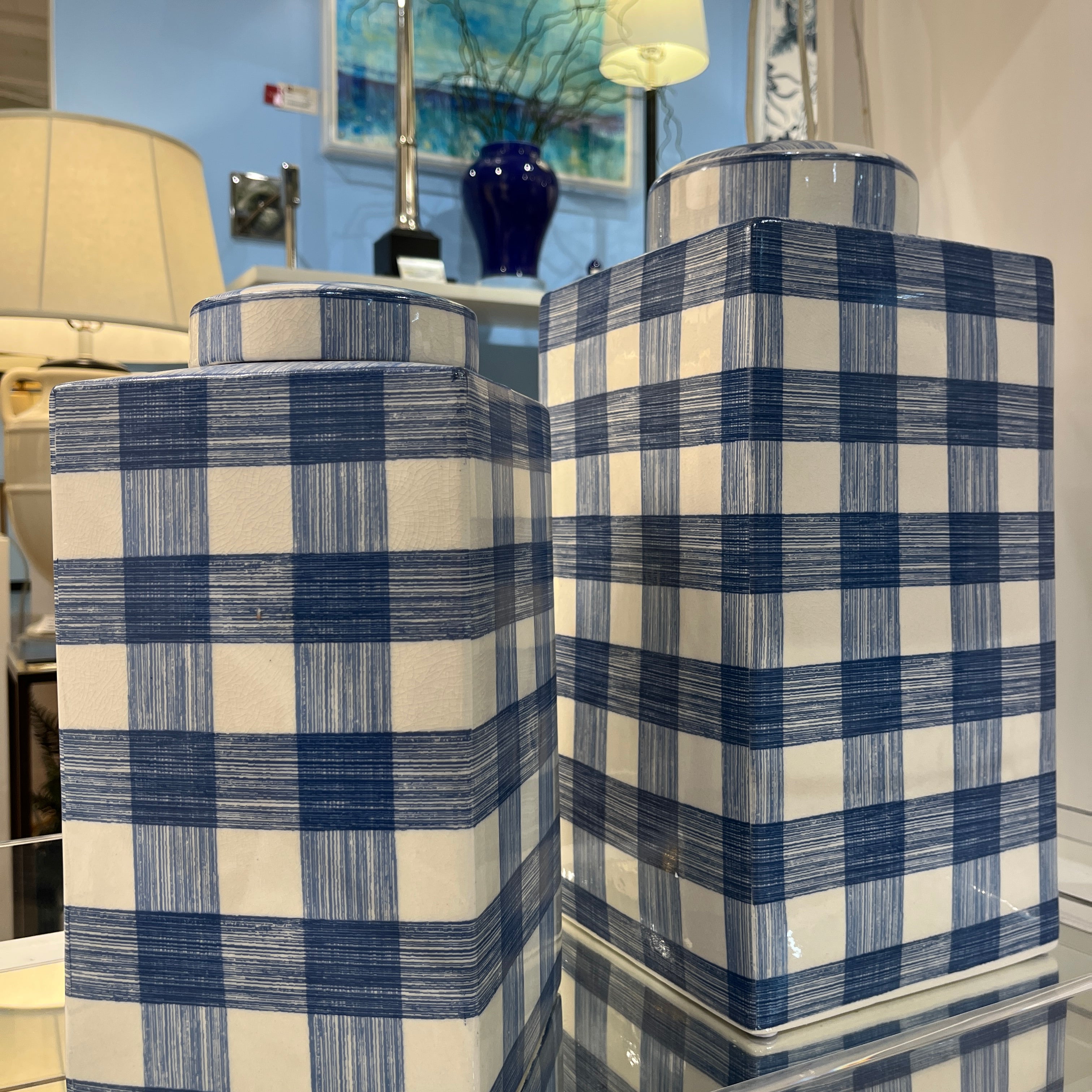two blue and white lidded jars in a gingham pattern from Madcap Cottage