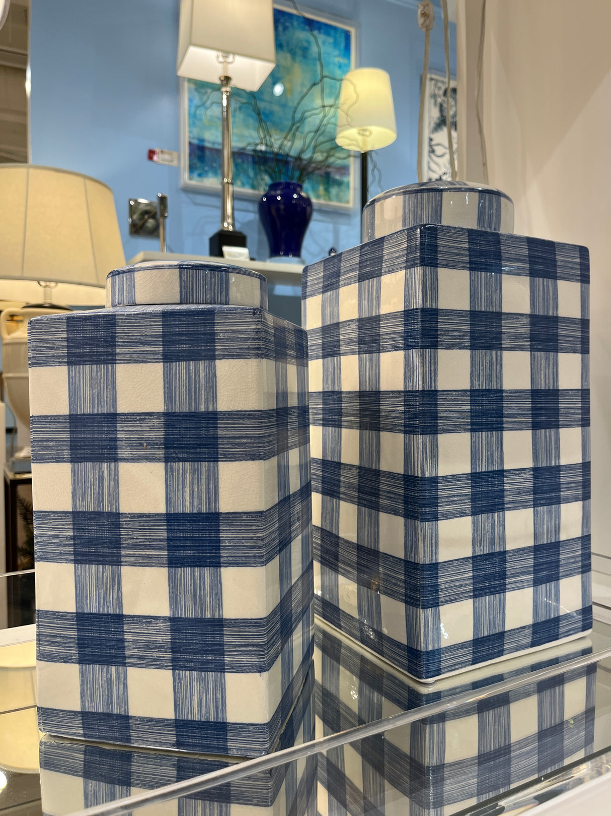 two blue and white lidded jars in a gingham pattern from Madcap Cottage