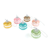 Colorful macaron ornaments on a white background