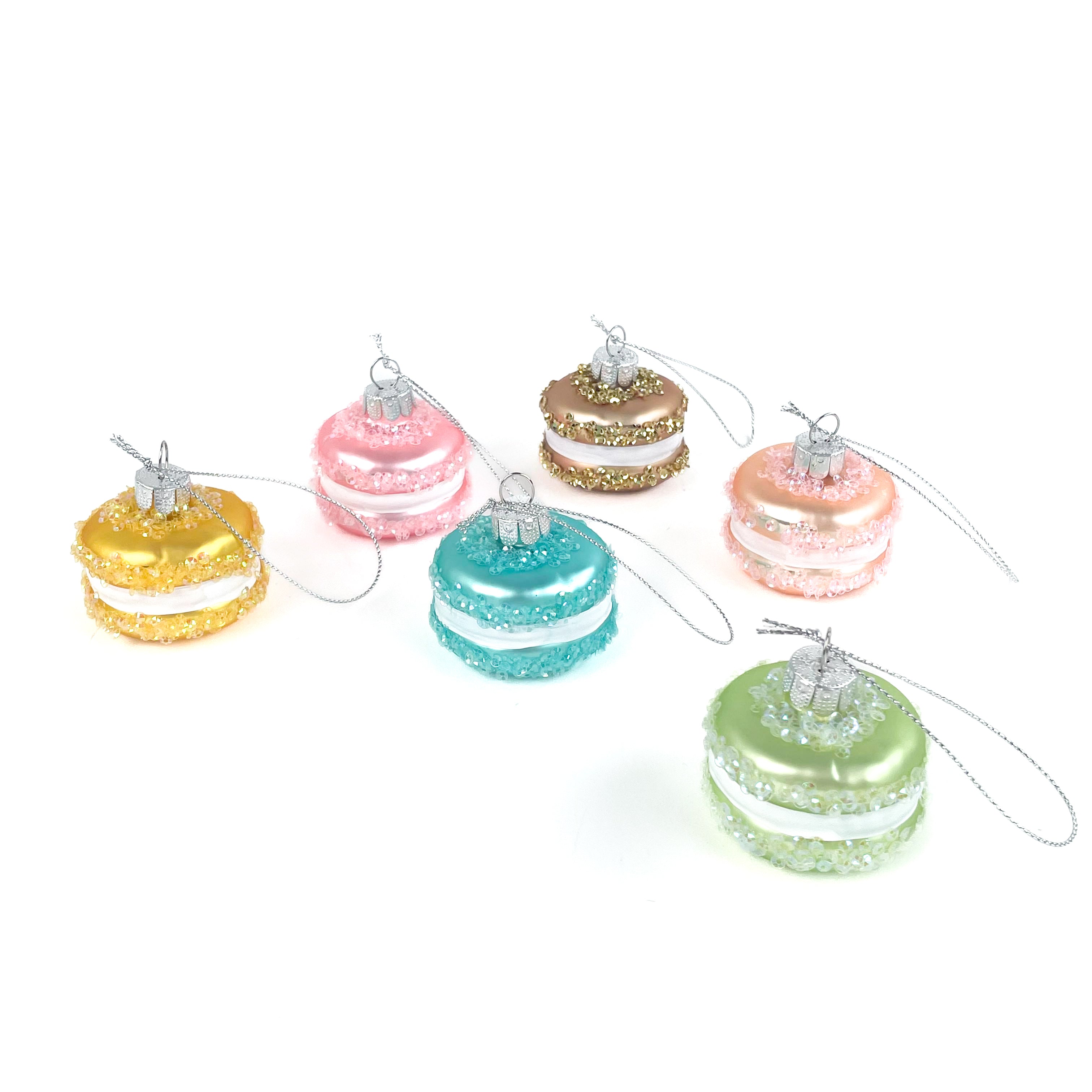 Colorful macaron ornaments on a white background