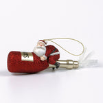 a santa riding a red champagne bottle ornament against a white background