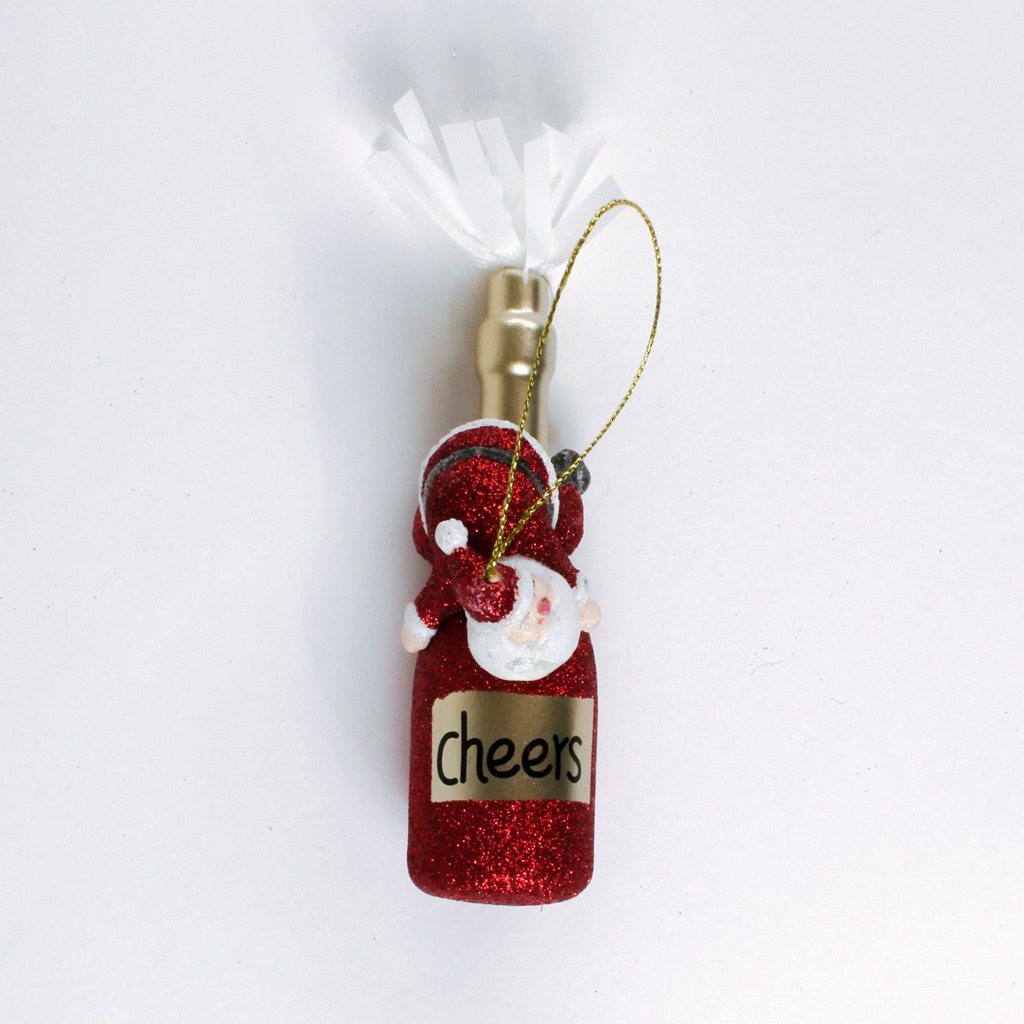 a santa riding a red champagne bottle ornament against a white background