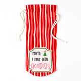 red and white striped drawstring bag with a “Santa, I have been goodish” label on the front