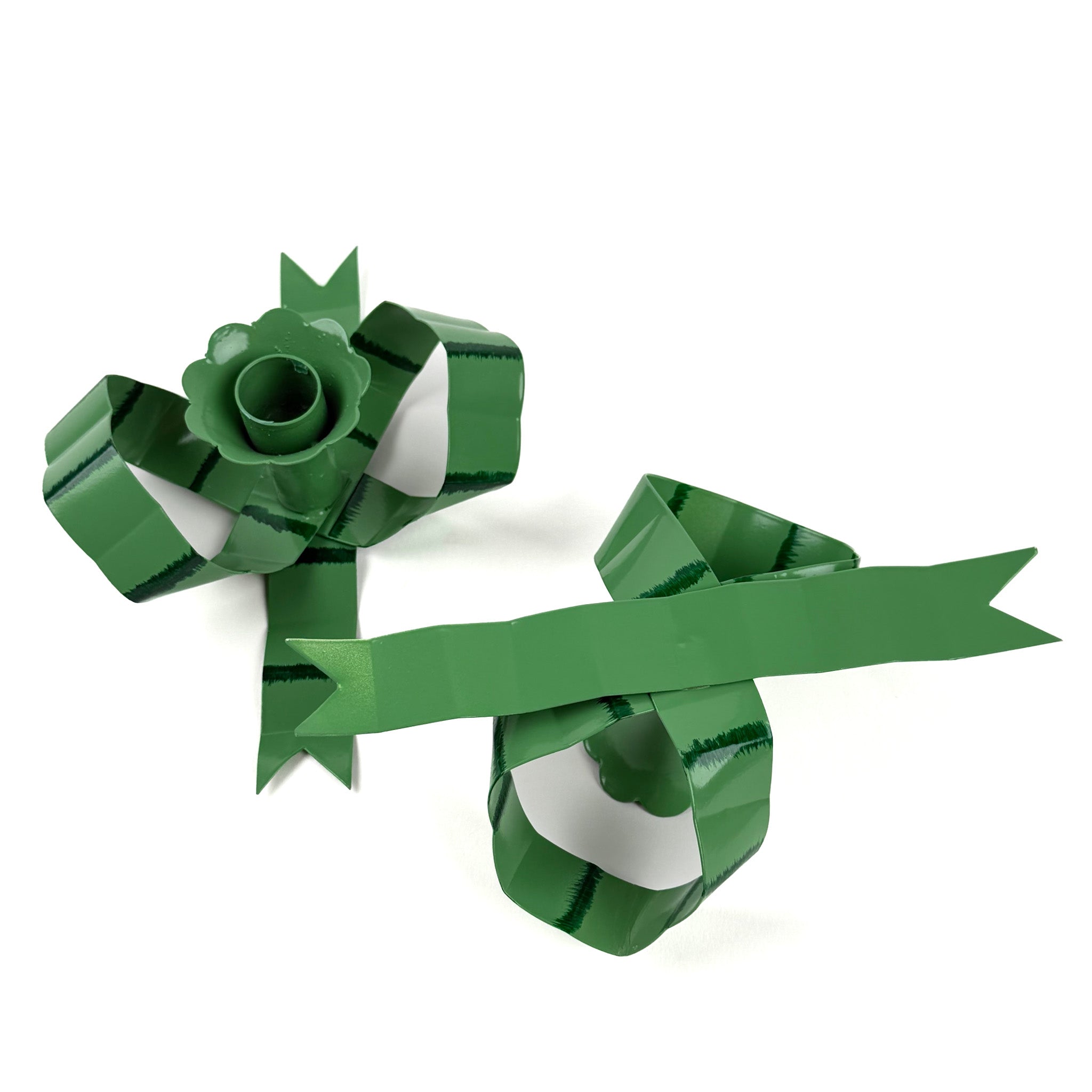 pair of green bow-shaped candleholders without candles