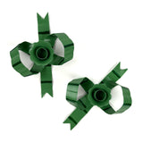 pair of green bow-shaped candleholders