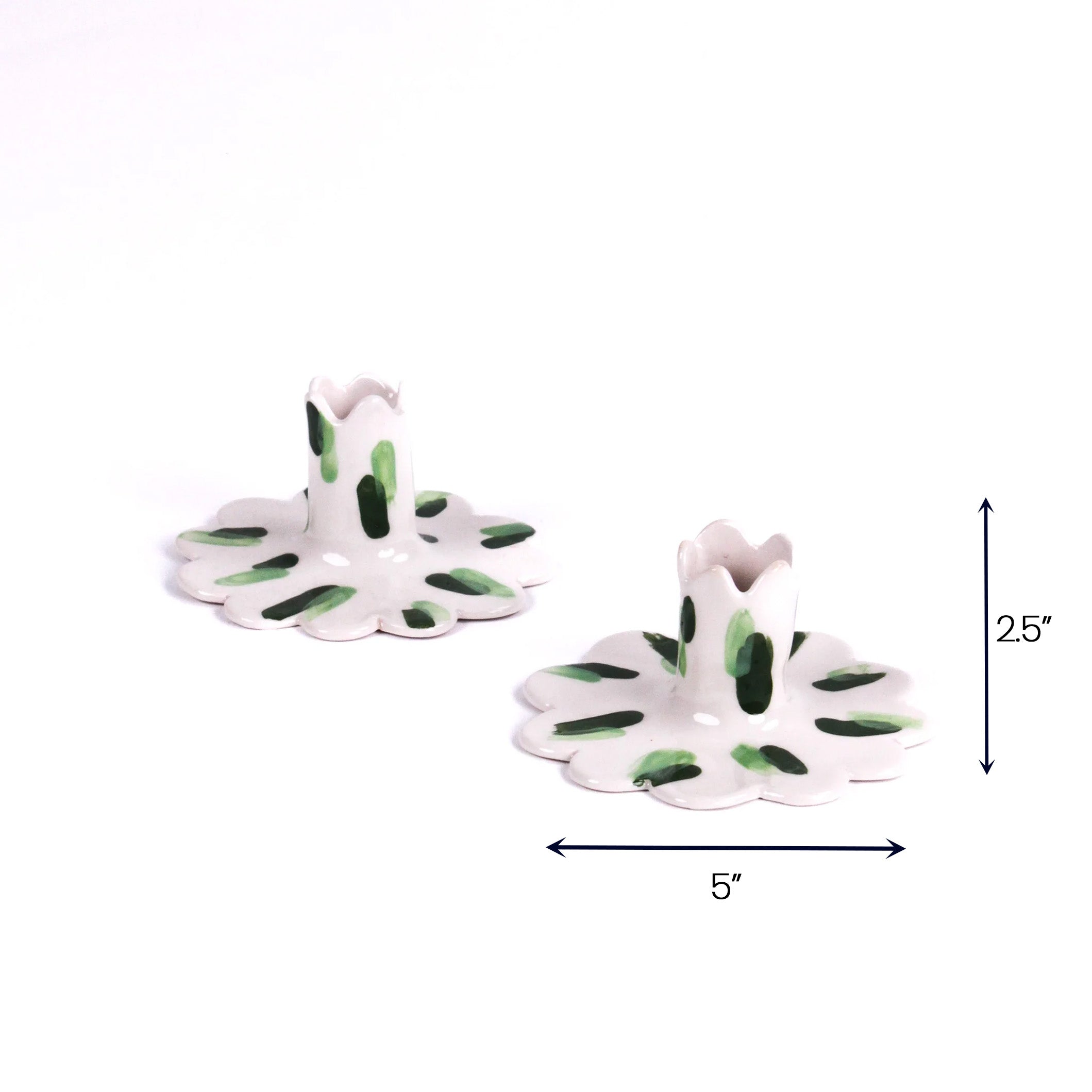 Green scalloped candle holder with dimension of 5" x 2.5".