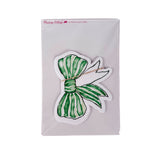 Pack of green bow–shaped paper place cards with hand-painted striped bow design, shown in clear packaging on a white background.