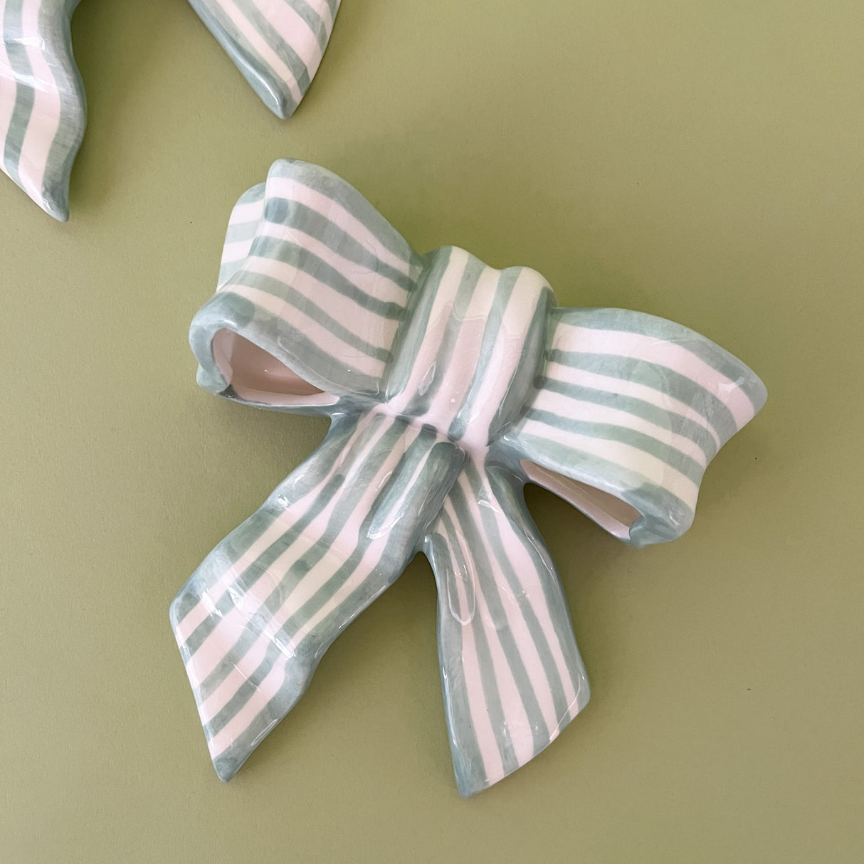 green and white ceramic bow tabletop decor