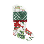 Floral geranium red Christmas stocking with green lattice design cuff on a white background