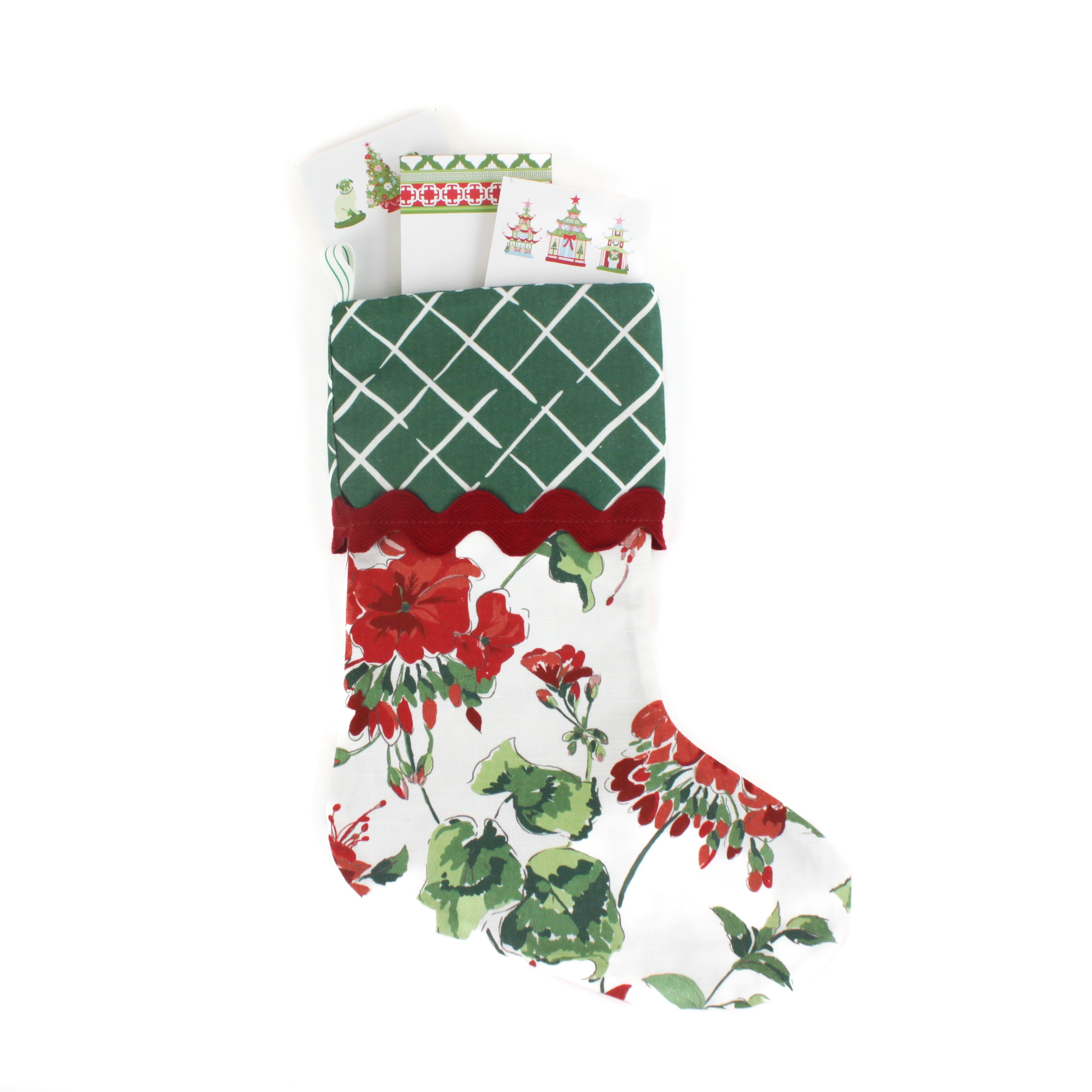 Floral geranium red Christmas stocking with green lattice design cuff on a white background