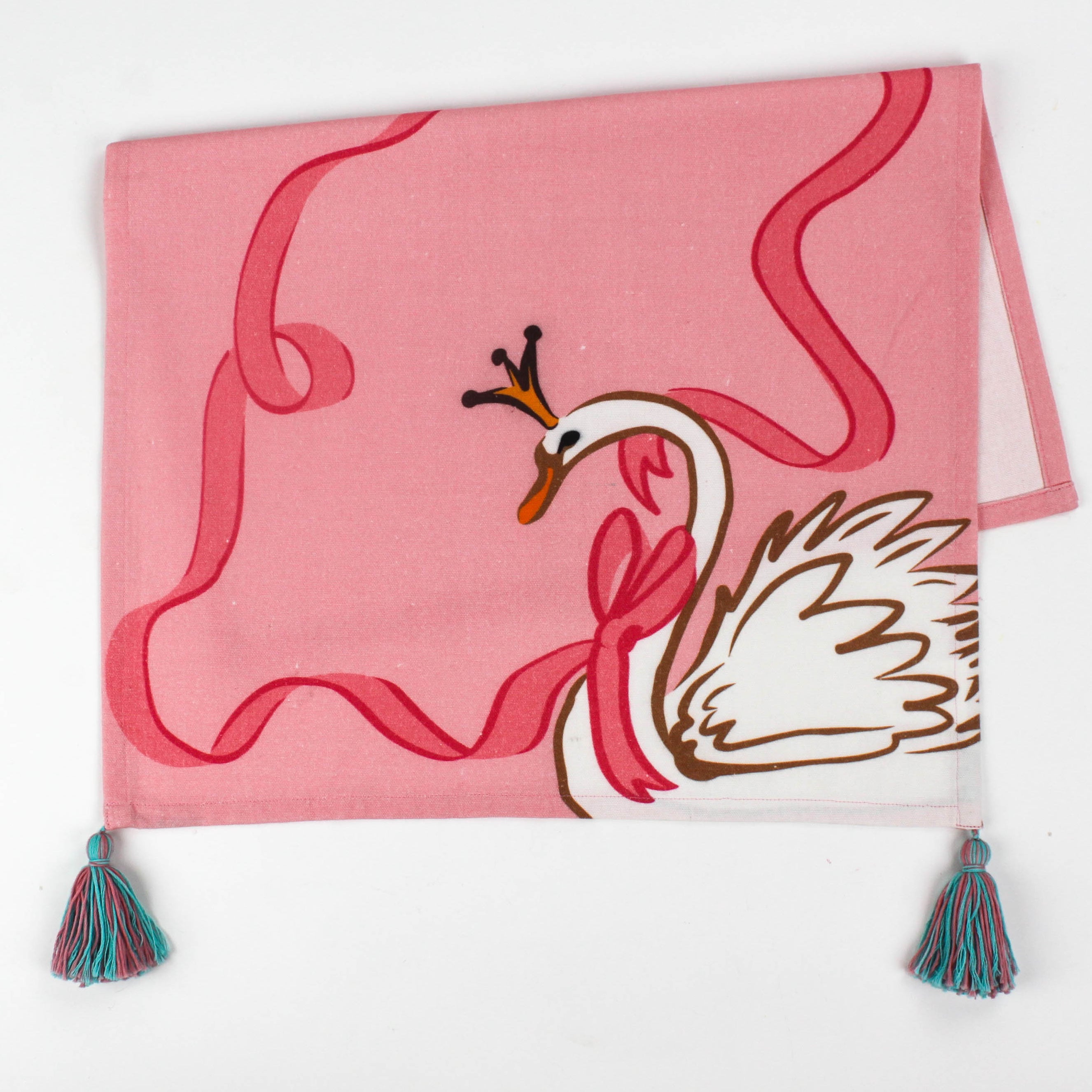Christmas tea towel designed with a white swan with a golden crown and pink ribbon on a pink background 