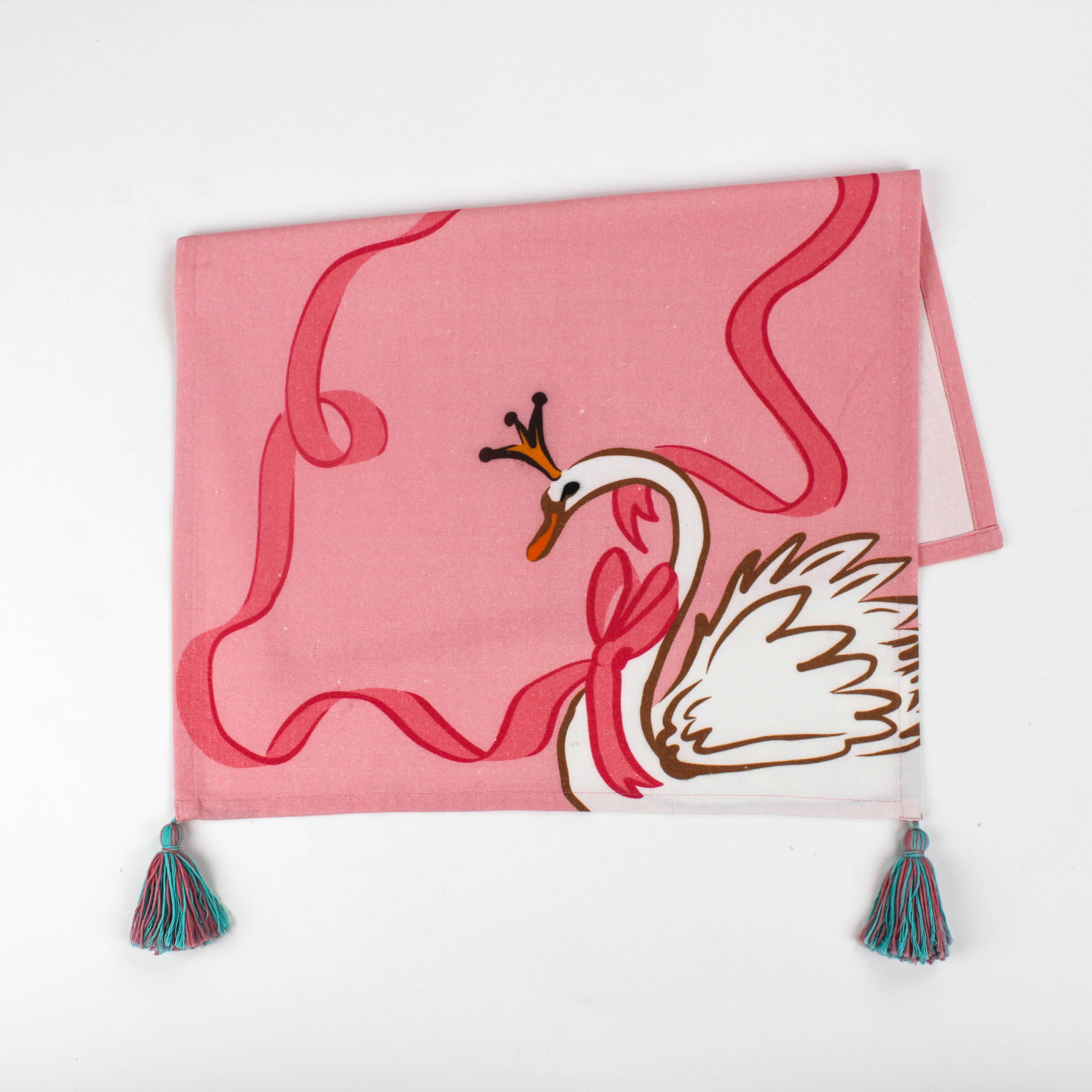 Christmas tea towel designed with a white swan with a golden crown and pink ribbon on a pink background 