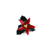 Front view of a hand-painted metal poinsettia napkin ring with red petals and gold center.