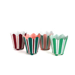 Set of four hand-painted scalloped tole cachepots in festive striped designs, displayed upright.