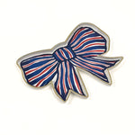 hand-painted tole tray featuring a patriotic red, white, and blue bow with gold trim on a clean white background.
