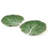 a ceramic green cabbage leaf plate on a white background.