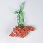 Handcrafted Pink Orange Shells Felt Christmas Ornament in red scallop shell shape with white stitched lines and green gingham ribbon.