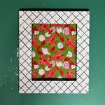 A blue and white photo frame featuring a trellis pattern from madcap cottage